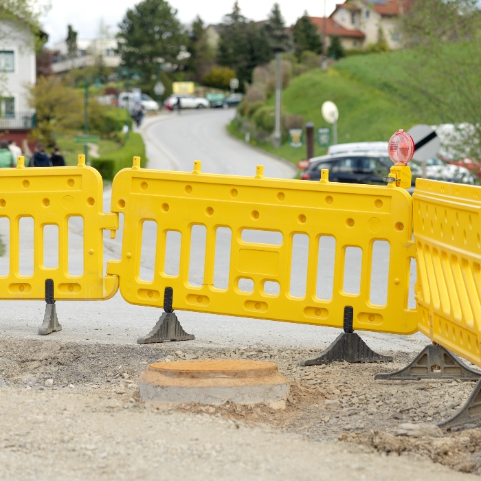 a-plastic-yellow-barrier-fence-on-the-street-road-2025-03-24-16-08-22-utc Safety Barriers - Image 1